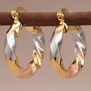 Elegant tri-color twisted hoop earrings in gold, silver, and rose gold finishes