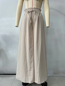 Vue détaillée du pantalon large taille haute abricot avec cordon de serrage à la taille