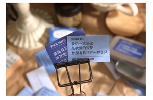 Macro shot of vintage style literature stickers with quote cards and metal clips