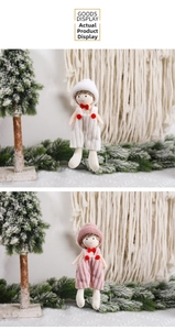 Detail view of knitted Christmas gnome ornaments in pink and white outfits for holiday decor