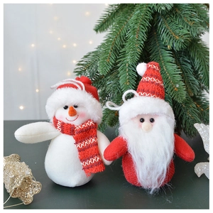 Detail of plush Santa and Snowman ornaments with knitted textures for Christmas trees
