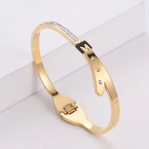 Elegant gold titanium bangle with sparkling rhinestones and black leather strap buckle