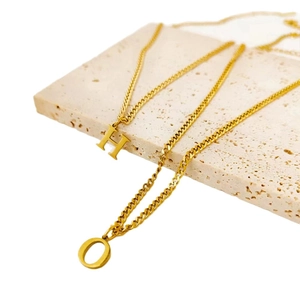 Minimalist stainless steel necklace with gold initial pendants H and O for women