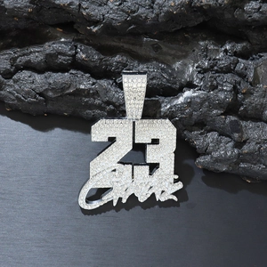 Detailed view of icy silver Number 23 pendant with Jordan script on dark background