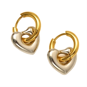 Two-tone heart drop earrings in gold and silver finish with minimalist oval hoops