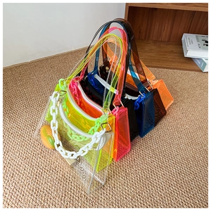 Detailed macro view of colorful PVC jelly bags with matching chain straps in various vibrant colors