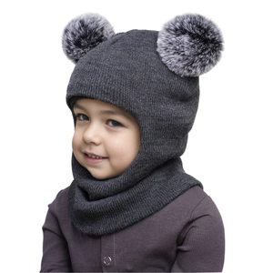 Detail of dark grey knit baby winter hat with double faux fur pom-poms and ear protection