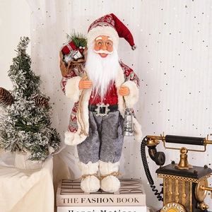 Detail of 18-inch standing Santa figure with knit coat, vintage lantern and gift sack