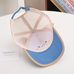 Detail view of breathable blue mesh back and adjustable strap on children's baseball cap