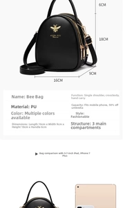 Detail view of black PU leather crossbody bag featuring three main compartments and gold bee logo