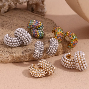 Detailed shot of 18K gold plated C-shaped earrings with colorful crystals and pearls