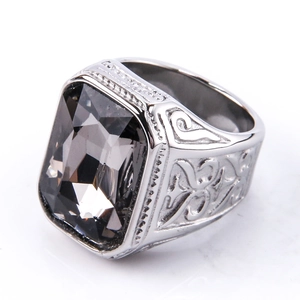 Detailed close-up of vintage silver steel ring with a large square black gemstone and relief
