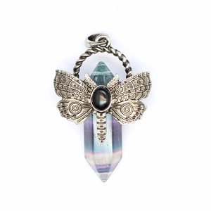 Macro shot of natural fluorite crystal pillar necklace with vintage metal dragonfly detail