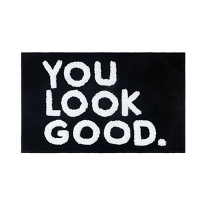 Black rectangular absorbent door mat with white YOU LOOK GOOD jacquard lettering