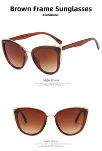Close-up of vintage cat eye sunglasses with brown resin frames and gold metal accents