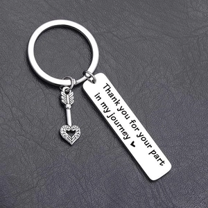 Close-up of stainless steel keychain with Thank you for your part in my journey engraving