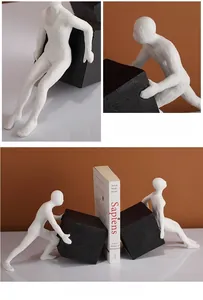 Detailed macro view of white resin figurine bookends featuring a modern matte grainy texture