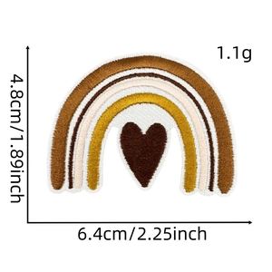 Macro detail of rainbow heart embroidery patch with size measurements in inches and cm