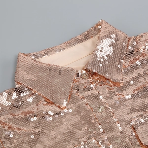 Close-up of rose gold sequin shirt collar showing high-quality metallic finish and texture