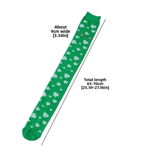 Detail of St. Patrick's Day over-knee socks with white shamrock pattern on green fabric