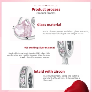 Detail of S925 sterling silver heart charm with pink glass and cubic zirconia inlay
