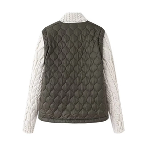 Back view of olive green quilted jacket featuring cream thick cable knit sleeves and collar