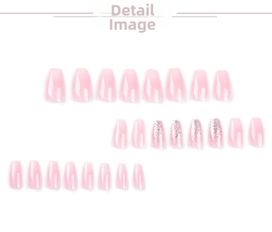 Detail view of pink gradient press-on nails with glitter in medium trapezoid shape