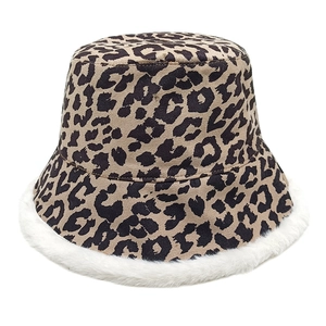 Detail shot of leopard print plush bucket hat with fluffy white faux fur trim edge