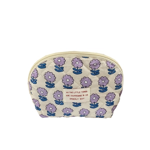Quilted cotton beige cosmetic bag with purple floral print and zipper closure