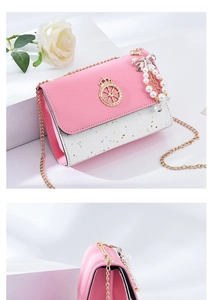 Detail of pink and white sequin crossbody bag with gold chain and pearl bow charm