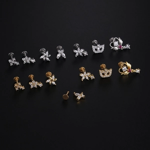 Various gold and silver surgical steel labret studs with butterfly and zircon designs