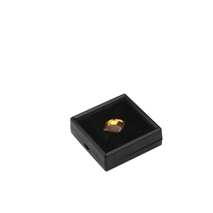 Yellow faceted crystal displayed in a black square PE film floating jewelry box