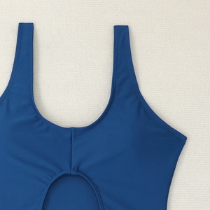 Detail view of navy blue one-piece swimsuit featuring U-neck and cutout design