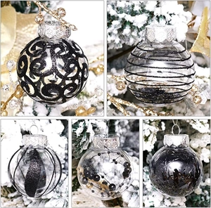 Detail of 6cm clear Christmas ornaments with black glitter swirls and silver metal caps