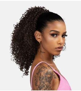 Detail of black afro kinky curly ponytail hair extension on model in studio lighting