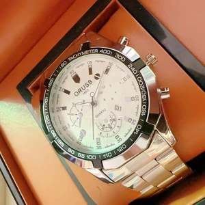 Macro view of ORUSS men's steel watch with tachymeter and date in a gift box