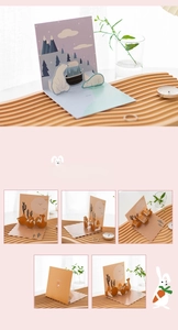 Detailed view of 3D pop-up cards featuring polar bear and fox in a forest scene