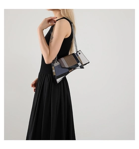 Chic asymmetric shoulder bag with geometric plaid pattern and elegant silver chain strap