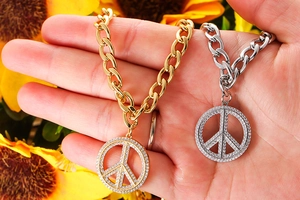 Detail of peace symbol pendant with inlaid cubic zirconia and fashion chunky chain link
