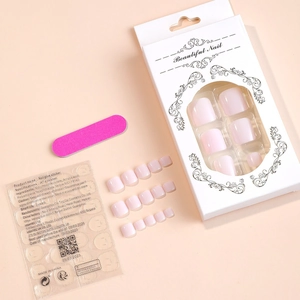 Detailed set of soft pink press-on toenails with adhesive tabs and file in packaging