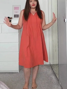 Coral orange sleeveless V-neck A-line midi dress with elegant vertical pleats