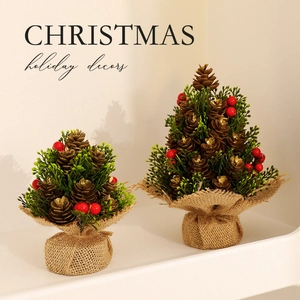 Mini burlap Christmas trees set with red berries and pine cones for festive table decor