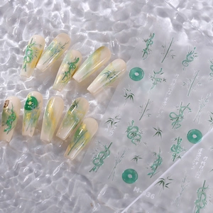Green bamboo and jade style nail art stickers with gold foil accents for manicure decor