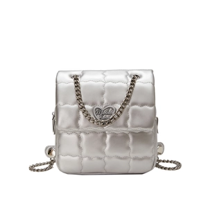 Silver quilted crossbody bag with heart charm and elegant metal chain strap for women