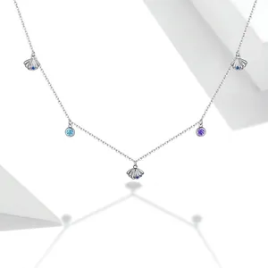 Minimalist S925 sterling silver ocean shell necklace with blue zircons on white background