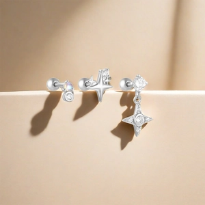 Detailed view of S925 silver star earrings featuring iridescent opal and screw back studs