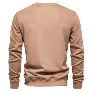 Detail of the crewneck ribbing and seamless back construction of the khaki sweatshirt