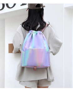 Macro shot of waterproof drawstring backpack with iridescent holographic finish and zip pocket