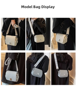 Detailed view of the women mini square bag with wide woven strap and turn-lock closure.