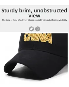 Detail of high-quality golden CHINA 3D embroidery on a black cotton baseball cap